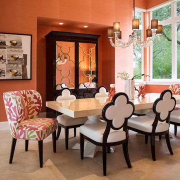 A striking orange grasscloth wraps this contemporary dining room