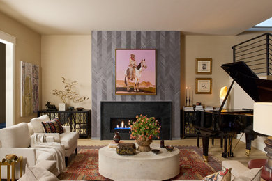 Living room - mid-sized transitional open concept light wood floor, wallpaper and multicolored floor living room idea in Denver with beige walls and a standard fireplace