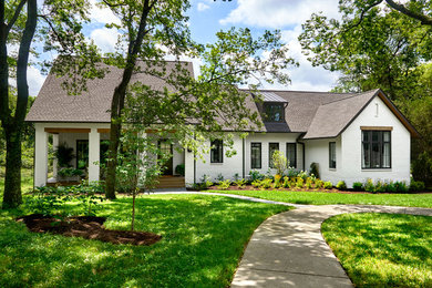 Photo of a transitional two-storey white exterior in Nashville.