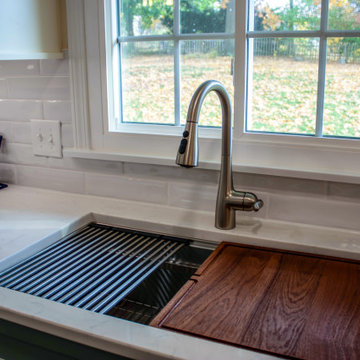 Custom Two-Toned Green and White Kitchen with Laventa Carrara Quartz Countertops