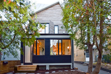 Mid-sized contemporary white three-story wood gable roof idea in Toronto