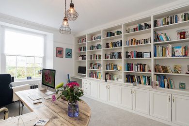 Medium sized contemporary study in Other with white walls, carpet, a freestanding desk and grey floors.