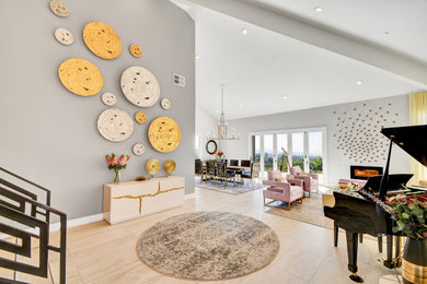 Entryway - large contemporary porcelain tile, gray floor and vaulted ceiling entryway idea in Los Angeles with gray walls and a metal front door