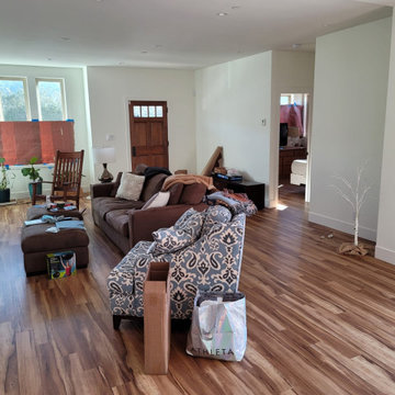 Open Living Room Remodel with Warm Wood-Look Flooring