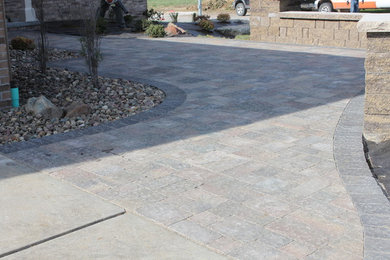 Patio - front yard concrete paver patio idea in Omaha