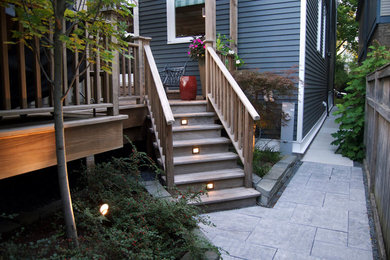 Mid-sized transitional porch photo in Chicago with decking and a pergola