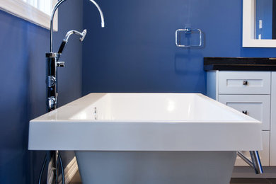 Inspiration for a mid-sized contemporary master gray tile and ceramic tile ceramic tile bathroom remodel in Toronto with shaker cabinets, white cabinets, blue walls, an undermount sink and solid surface countertops