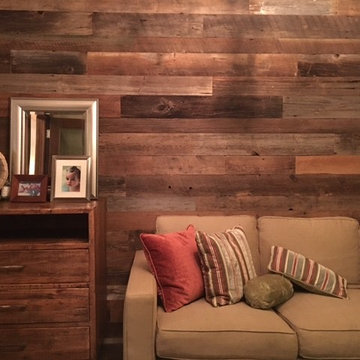 Weathered Antique Paneling Accent Wall in a Cozy Traditional Living Room