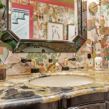 Whimsical Eclectic Bathroom with Bold Wallpaper and Luxe Accents
