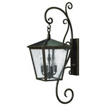 Hinkley - Hinkley 1436RB Trellis - Four Light Large Outdoor Wall Mount - Trellis is a traditional European hanging wall lantern design in a Regency Bronze finish with dense clear seedy glass. The large scroll arm detail, cast loop finial and true rivet detail create a refined elegance.
