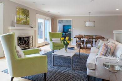 Living room - mid-sized transitional enclosed medium tone wood floor and brown floor living room idea in Santa Barbara with a standard fireplace, a brick fireplace and beige walls