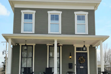 Example of an arts and crafts two-story wood and clapboard exterior home design