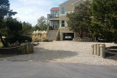 Beach style home design photo in Other