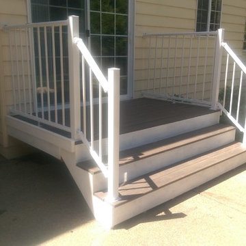 Removal of concrete back steps and construction of larger pvc deck and aluminum