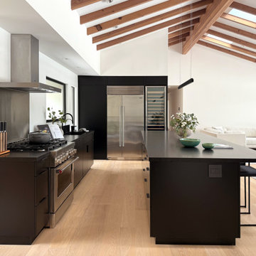 Full black kitchen in open space