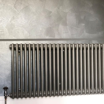 Stripe bespoke walls in dark tones with modern furniture