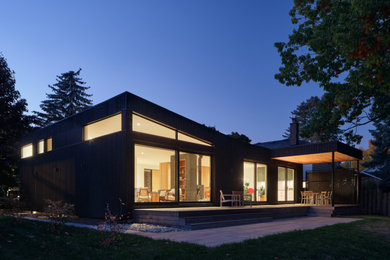 Minimalist black exterior home photo in Other