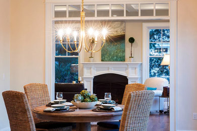 Enclosed dining room - mid-sized coastal light wood floor and brown floor enclosed dining room idea in Boston with white walls and no fireplace