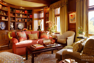 Example of a large classic dark wood floor and brown floor home office library design in San Francisco with brown walls