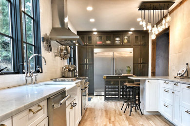 Kitchen - farmhouse light wood floor kitchen idea in New York with stainless steel appliances and an island
