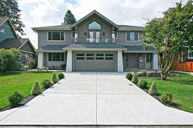Trendy gray mixed siding gable roof photo in Vancouver
