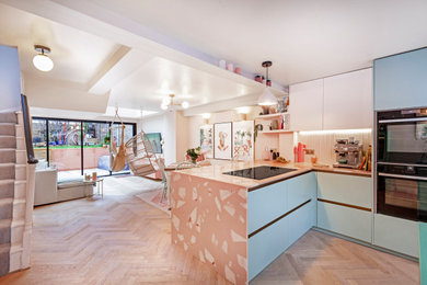 Design ideas for a medium sized victorian l-shaped open plan kitchen in London with an island.