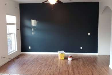 Inspiration for a large timeless light wood floor and brown floor bedroom remodel in St Louis
