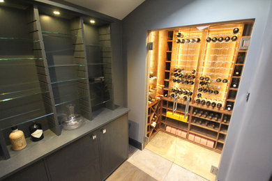 Medium sized contemporary wine cellar in Other.