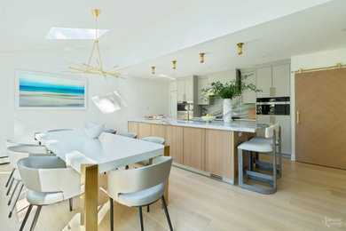 Example of a large trendy light wood floor and brown floor dining room design in New York