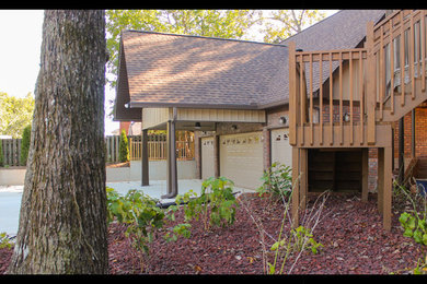 Inspiration for a large craftsman attached four-car porte cochere remodel in Birmingham