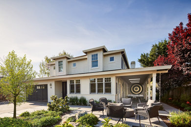 Transitional beige two-story clapboard house exterior idea in San Francisco with a hip roof