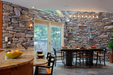 Large arts and crafts marble floor eat-in kitchen photo in New York with a farmhouse sink, shaker cabinets, medium tone wood cabinets, granite countertops, multicolored backsplash, stone tile backsplash, stainless steel appliances and a peninsula