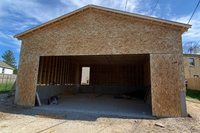 Example of a large minimalist garage design in Milwaukee