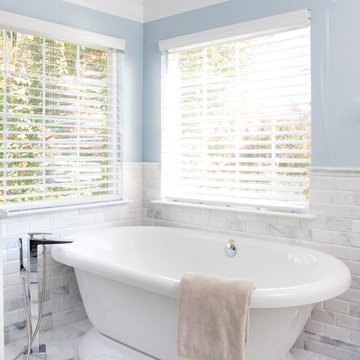 Freestanding pedestal tub with riser faucet