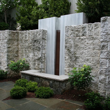 Granite Water Wall and Fieldstone Pool Topped with Limestone Cap