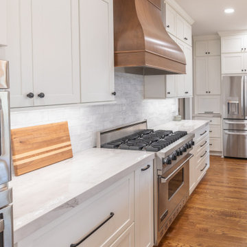 Porcelain Island Kitchen Remodel with Custom Built-Ins + Fireplace Feature