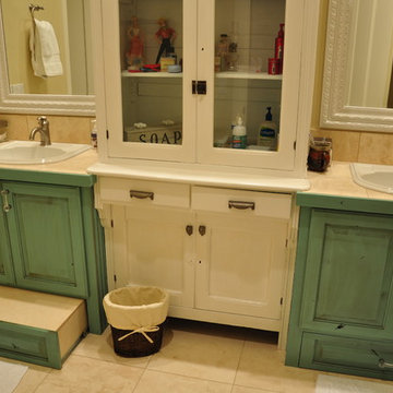 Notice the built in stool that pulls out under the cabinets.