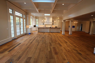 Mountain style light wood floor eat-in kitchen photo in DC Metro with raised-panel cabinets, white cabinets, granite countertops, blue backsplash, stainless steel appliances and an island