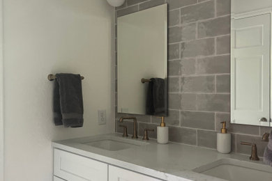 Example of a transitional bathroom design in Denver