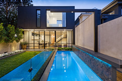 This is an example of a small modern courtyard custom-shaped pool in Melbourne.