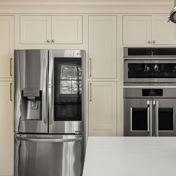 Warm Traditional Kitchen Remodel with Cream Cabinets & Herringbone Floors