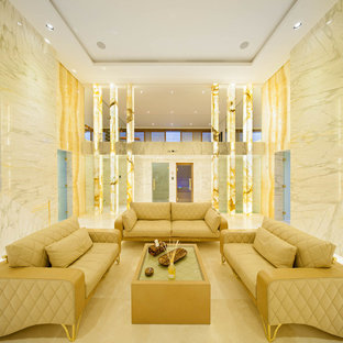 Design ideas for a large contemporary walk-out basement in Moscow with white walls, marble flooring and no fireplace.
