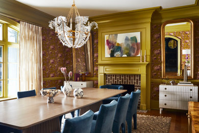 Transitional medium tone wood floor, brown floor and wallpaper enclosed dining room photo in Charlotte with brown walls, a standard fireplace and a brick fireplace
