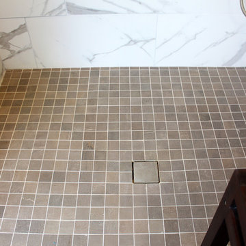 Gray Vanity with Freestanding Tub and Tiled Walkin Shower