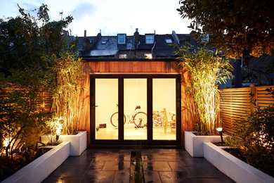 Photo of a contemporary garden shed and building in London.