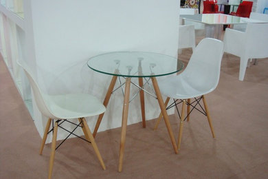Molded plastic chairs and glass table top