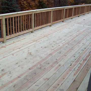 LARGE BASIC PRESSURE TREATED DECK WITH CEDAR INFILL AND BALUSTERS