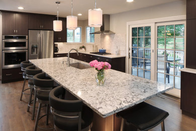Inspiration for a modern kitchen with flat-panel cabinets, quartz benchtops, with island and white benchtop.