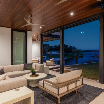 Modern Luxury Lakehouse This stunning aerial photograph captures a luxurious mod
