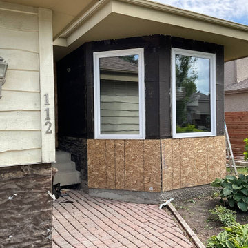 Siding Installation - Versetta Stone and James Hardie Plank in Iron Gray